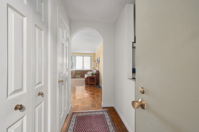 301 E 22nd St Unit 9V, New York City, NY 10010 - corridor featuring baseboards and arched walkways
