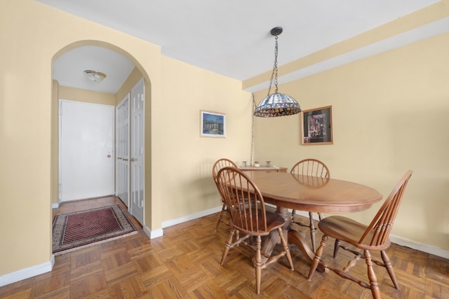 301 E 22nd St Unit 9V, New York City, NY 10010 - dining area featuring arched walkways and baseboards