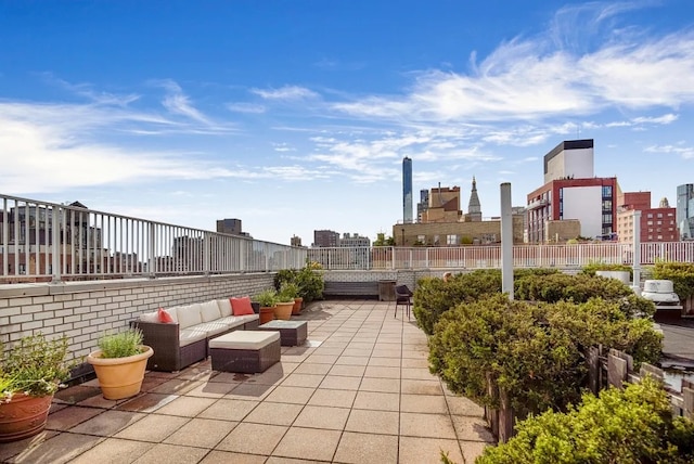 301 E 22nd St Unit 9V, New York City, NY 10010 - view of patio / terrace featuring an outdoor living space and a skyline view