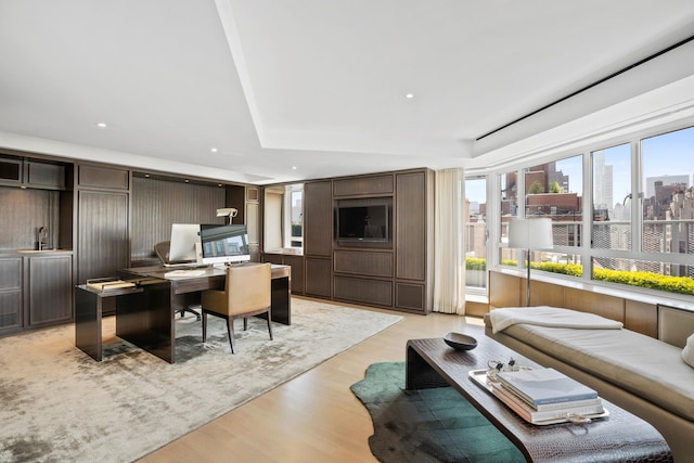 799 Park Ave Unit 19/20B, New York City, NY 10021 - living area with light wood-style flooring, an office area, recessed lighting, and a raised ceiling