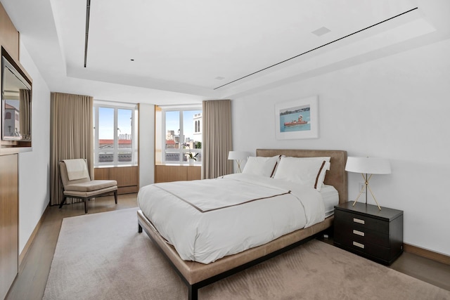799 Park Ave Unit 19/20B, New York City, NY 10021 - bedroom with a raised ceiling and wood finished floors