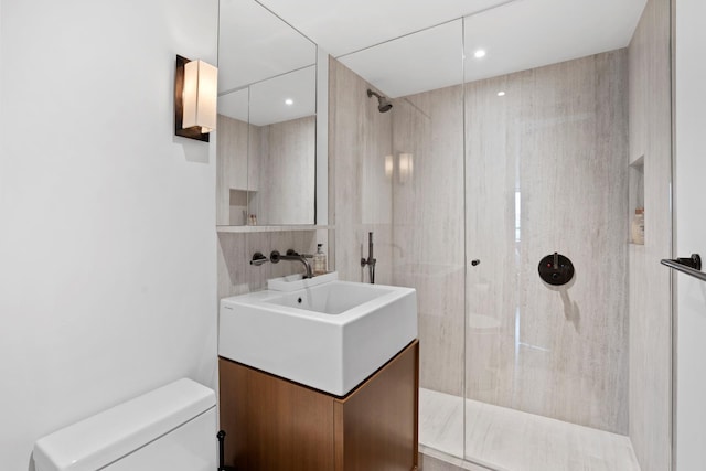 799 Park Ave Unit 19/20B, New York City, NY 10021 - bathroom featuring a walk in shower, toilet, and vanity