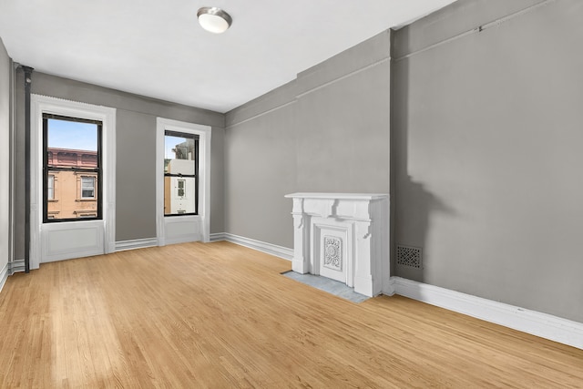 24 W 126th St, New York City, NY 10027 - empty room with light wood-style flooring and baseboards