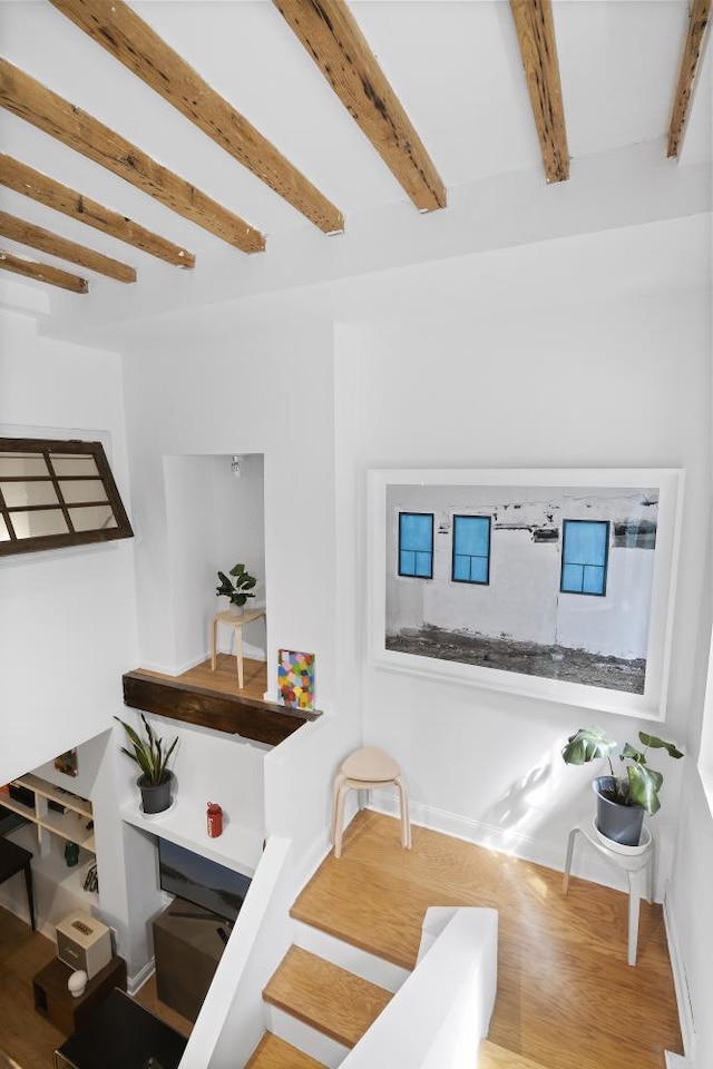 24 W 126th St, New York City, NY 10027 - dining space with beamed ceiling, wood finished floors, and baseboards