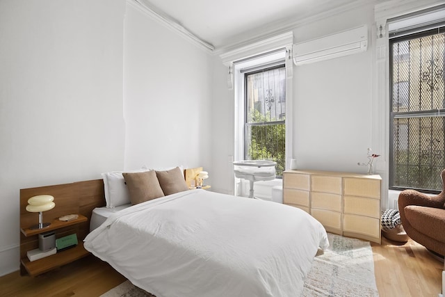 24 W 126th St, New York City, NY 10027 - bedroom with a wall mounted AC, crown molding, and wood finished floors