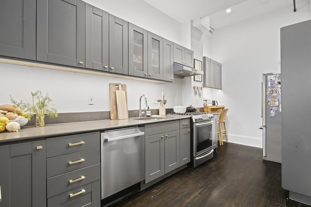 24 W 126th St, New York City, NY 10027 - kitchen featuring stainless steel appliances, gray cabinetry, dark wood-type flooring, under cabinet range hood, and recessed lighting