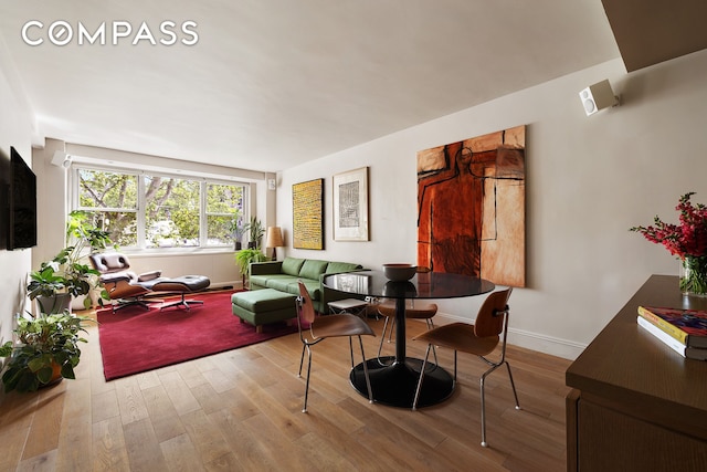 360 W 22nd St Unit 5M, New York City, NY 10011 - dining space with wood finished floors and baseboards