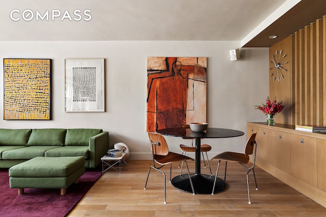 360 W 22nd St Unit 5M, New York City, NY 10011 - dining space with wood finished floors and baseboards