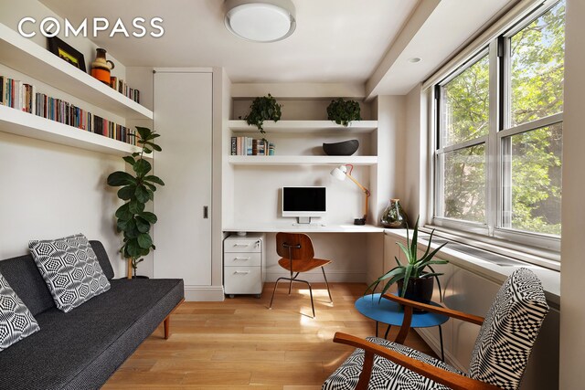 360 W 22nd St Unit 5M, New York City, NY 10011 - home office featuring built in study area and light wood finished floors