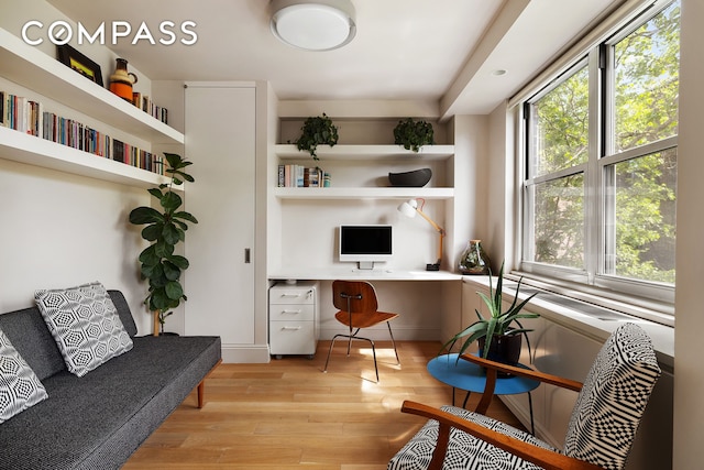 360 W 22nd St Unit 5M, New York City, NY 10011 - home office with built in study area and light wood-style floors