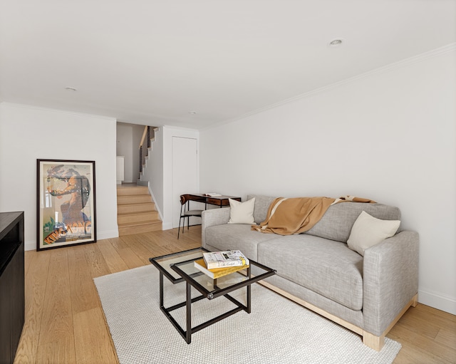 435 E 86th St Unit Gc, New York City, NY 10028 - living area with stairs, light wood-style floors, crown molding, and baseboards