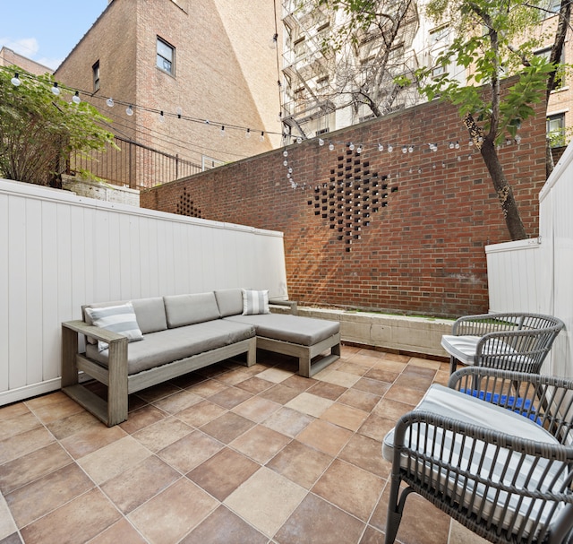 435 E 86th St Unit Gc, New York City, NY 10028 - fenced backyard with outdoor lounge area and a patio