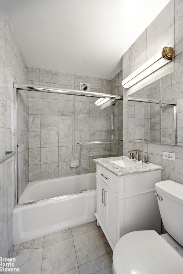 201 E 77th St Unit 7A, New York City, NY 10075 - bathroom featuring vanity,  shower combination, and tile walls