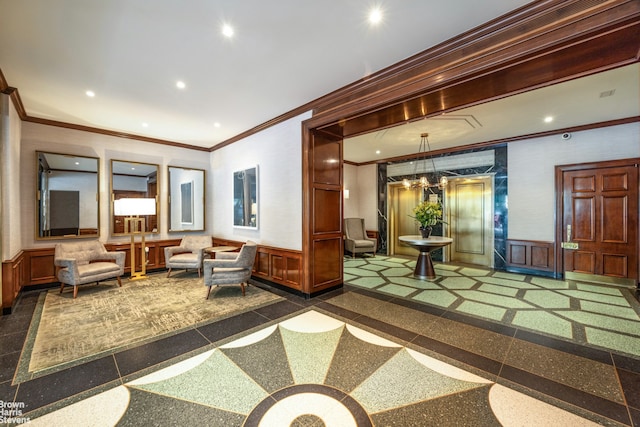 201 E 77th St Unit 7A, New York City, NY 10075 - building lobby with a wainscoted wall, ornamental molding, a decorative wall, and recessed lighting