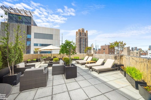 201 E 77th St Unit 7A, New York City, NY 10075 - view of patio featuring outdoor lounge area and a city view