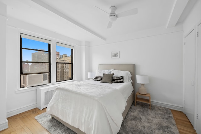 175 W 93rd St Unit 11B, New York City, NY 10025 - bedroom with light wood-style flooring, cooling unit, ceiling fan, and beamed ceiling