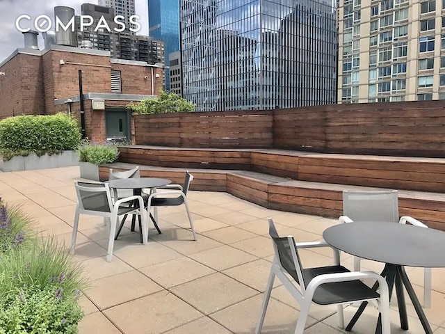 301 W 53rd St Unit 3I, New York City, NY 10019 - view of patio / terrace featuring outdoor dining area and a view of city