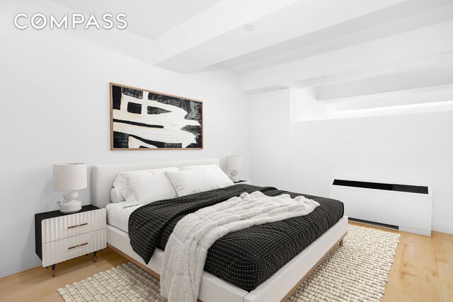 15 Broad St Unit 2414, New York City, NY 10005 - bedroom with light wood finished floors