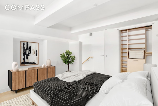 15 Broad St Unit 2414, New York City, NY 10005 - bedroom with light wood-style flooring