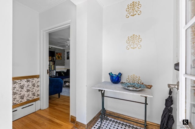 37 Centre St, New York City, NY 10464 - hall featuring baseboard heating, crown molding, and light wood-type flooring