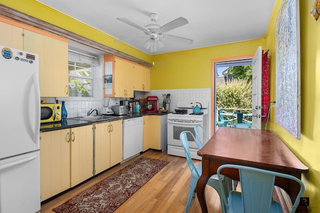 37 Centre St, New York City, NY 10464 - kitchen featuring white appliances, plenty of natural light, a sink, and dark countertops