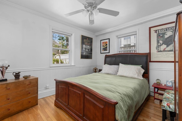 37 Centre St, New York City, NY 10464 - bedroom featuring light wood-style floors, crown molding, wainscoting, and a ceiling fan