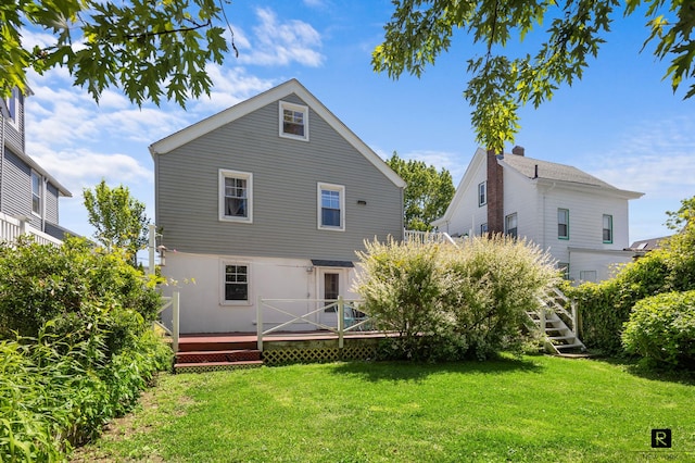 37 Centre St, New York City, NY 10464 - rear view of house featuring a wooden deck, a yard, and stucco siding