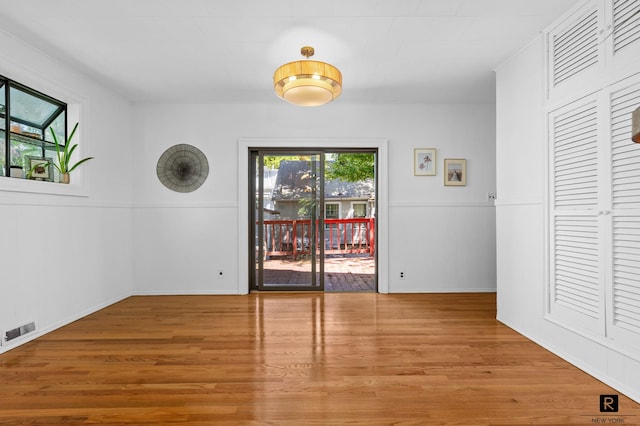 25 Bay St, New York City, NY 10464 - spare room featuring plenty of natural light and wood finished floors