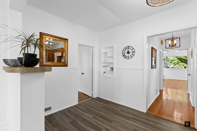 25 Bay St, New York City, NY 10464 - hallway with dark wood-style floors, crown molding, and a chandelier