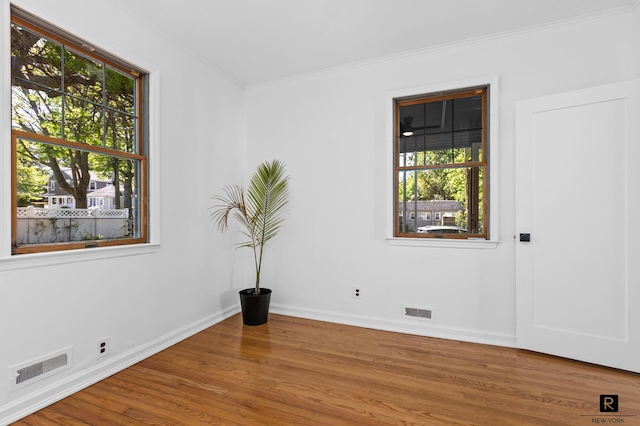 25 Bay St, New York City, NY 10464 - empty room with wood finished floors and crown molding