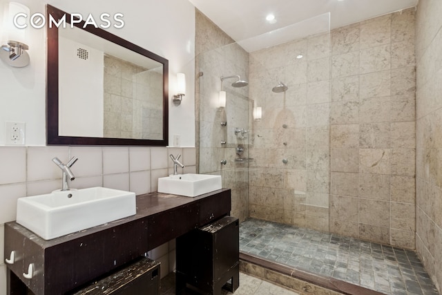 136-140 W 23rd St Unit 4Cc, New York City, NY 10011 - bathroom featuring a walk in shower and double vanity