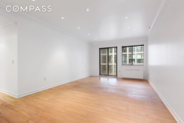 136-140 W 23rd St Unit 4Cc, New York City, NY 10011 - spare room with light wood-type flooring, ornamental molding, baseboards, and recessed lighting