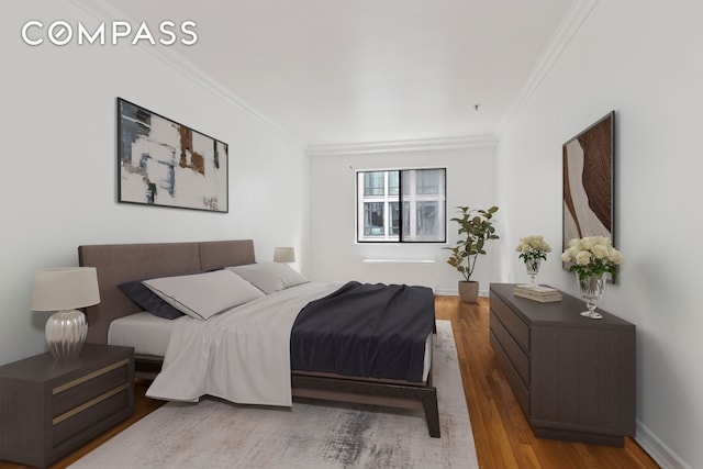 136-140 W 23rd St Unit 4Cc, New York City, NY 10011 - bedroom featuring crown molding and wood finished floors