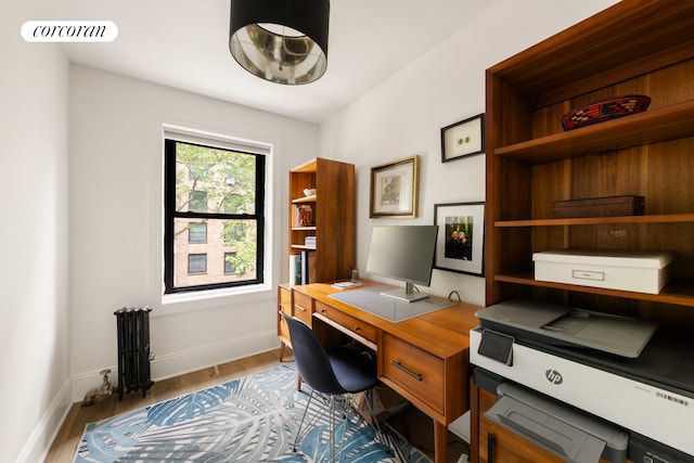 181 Waverly Ave, New York City, NY 11205 - home office featuring radiator, wood finished floors, and baseboards