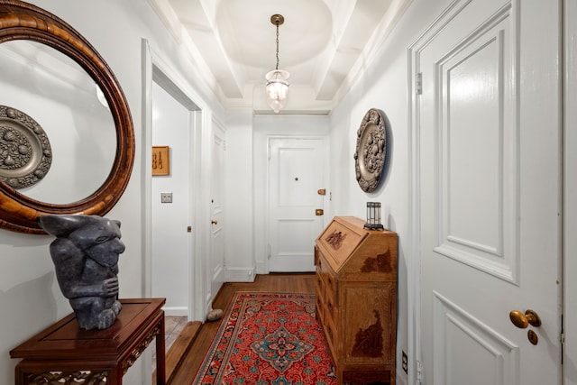 444 E 57th St Unit 5B, New York City, NY 10022 - entrance foyer with light wood-style flooring, crown molding, and a tray ceiling