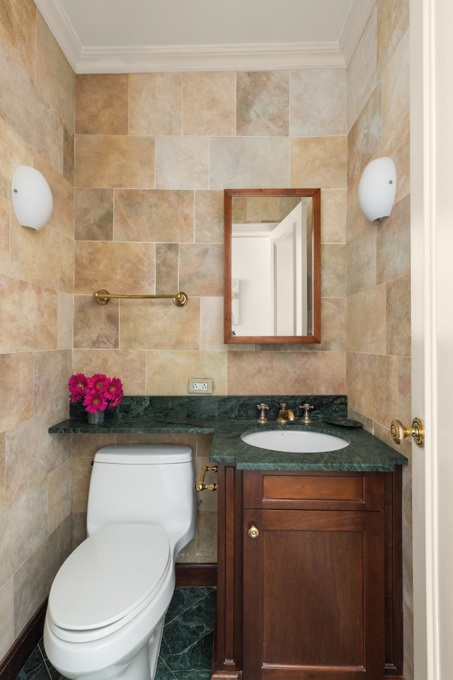 10 W 66th St Unit 30G, New York City, NY 10023 - bathroom with vanity, toilet, crown molding, tile walls, and marble finish flooring