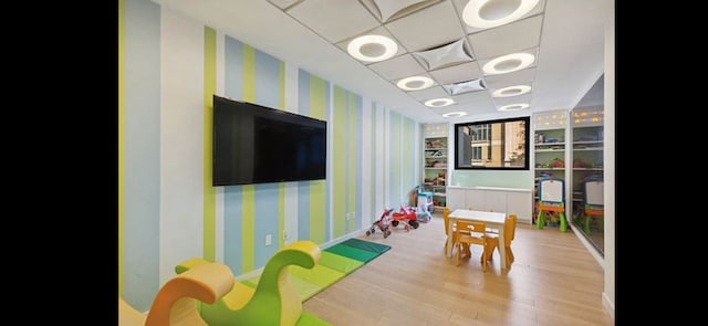 10 W 66th St Unit 30G, New York City, NY 10023 - playroom featuring wallpapered walls and wood finished floors