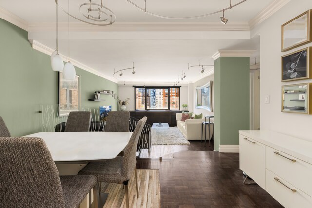 10 W 66th St Unit 30G, New York City, NY 10023 - dining space featuring crown molding and track lighting
