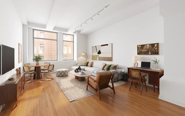 252 7th Ave Unit 5T, New York City, NY 10001 - living room featuring light wood-type flooring, track lighting, and an office area