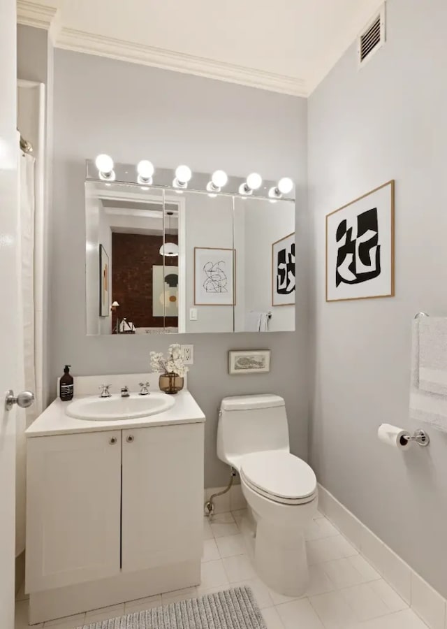 252 7th Ave Unit 5T, New York City, NY 10001 - bathroom with crown molding, toilet, vanity, and baseboards