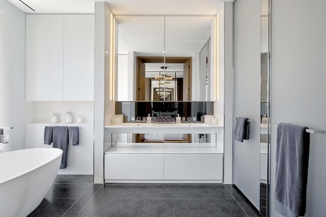 551 W 21st St Unit 16-B, New York City, NY 10011 - bathroom featuring a soaking tub and vanity