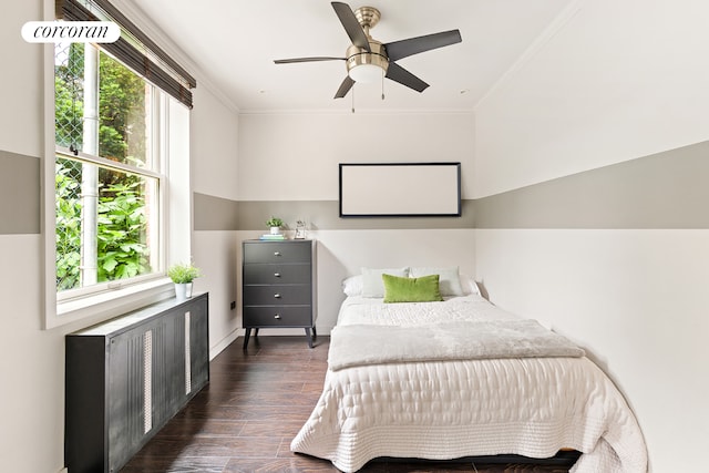 8301 Ridge Blvd Unit 1H, New York City, NY 11209 - bedroom with radiator heating unit, dark wood-type flooring, ornamental molding, and a ceiling fan