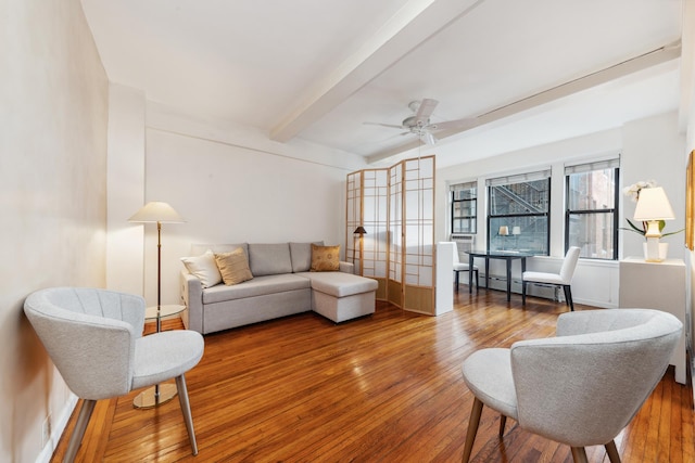 339 E 58th St Unit 7H, New York City, NY 10022 - living room featuring beam ceiling, wood-type flooring, ceiling fan, and a baseboard radiator