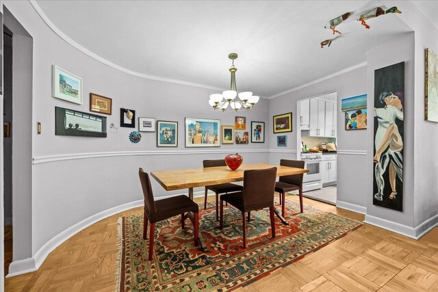 750 Kappock St Unit 1A, New York City, NY 10463 - dining space featuring a chandelier, baseboards, and crown molding
