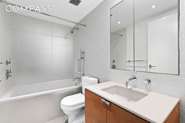 64 Clifton Place, New York City, NY 11238 - full bath featuring tile walls, toilet, vanity, shower / tub combination, and backsplash