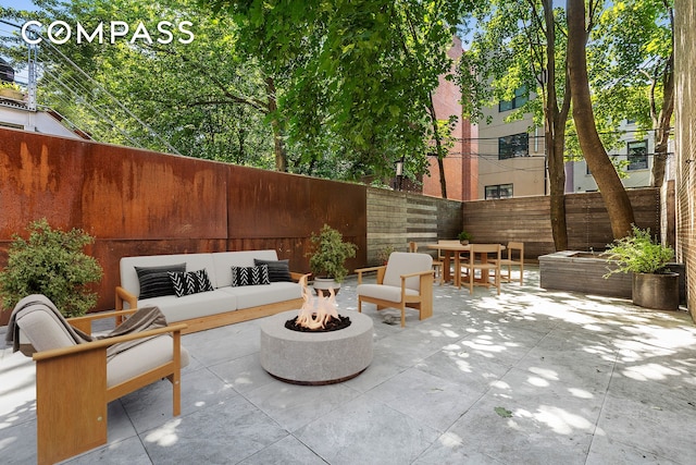 64 Clifton Place, New York City, NY 11238 - fenced backyard with a patio area, an outdoor living space with a fire pit, and outdoor dining area