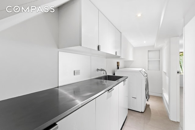 64 Clifton Place, New York City, NY 11238 - laundry area featuring cabinet space, washer / dryer, light tile patterned floors, and recessed lighting