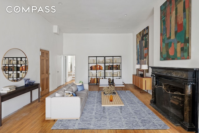 198 6th Ave, New York City, NY 10013 - living room with a fireplace, wood finished floors, and stairway