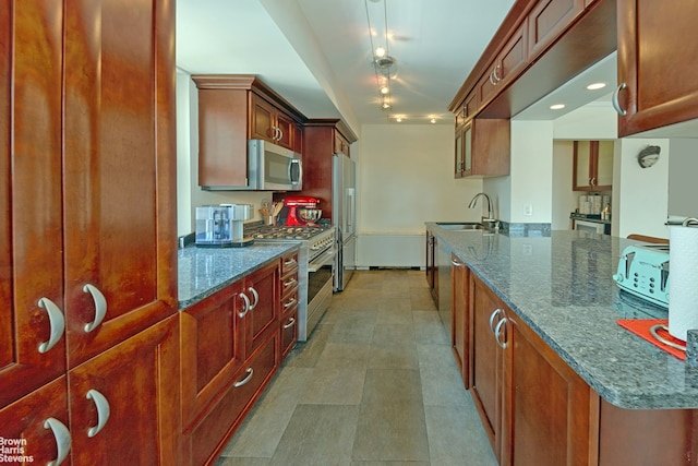 500 E 83rd St Unit 16M, New York City, NY 10028 - kitchen with stainless steel appliances, dark stone countertops, and brown cabinets