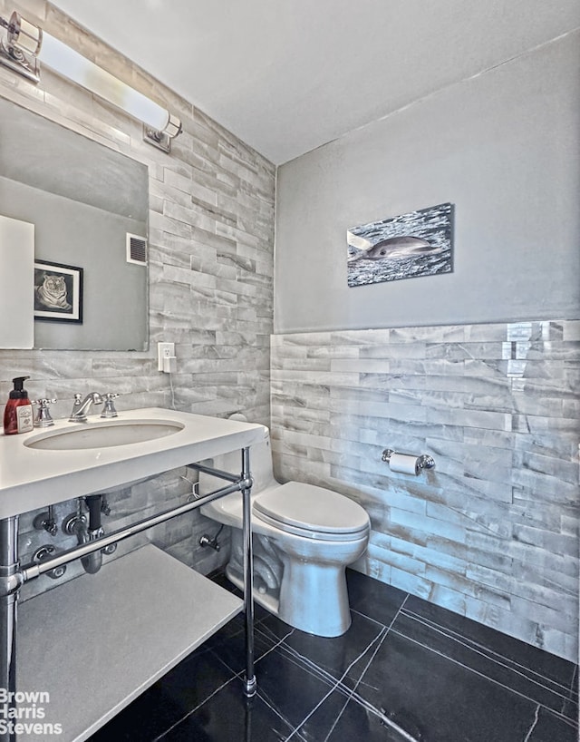 500 E 83rd St Unit 16M, New York City, NY 10028 - half bath featuring tile walls and tile patterned floors